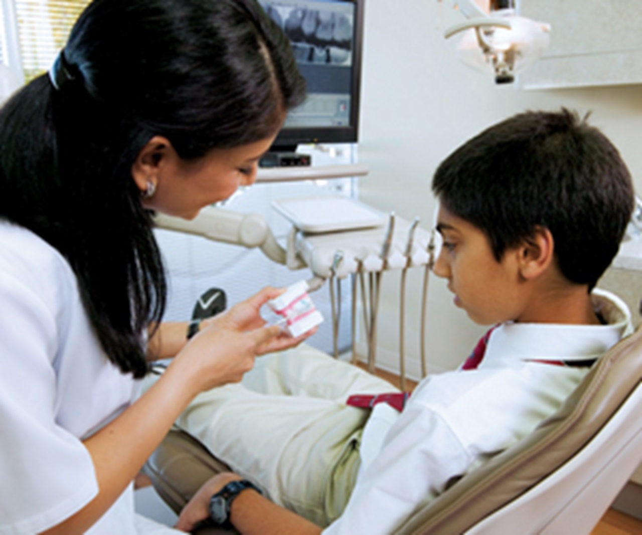 Dentist with boy patient.