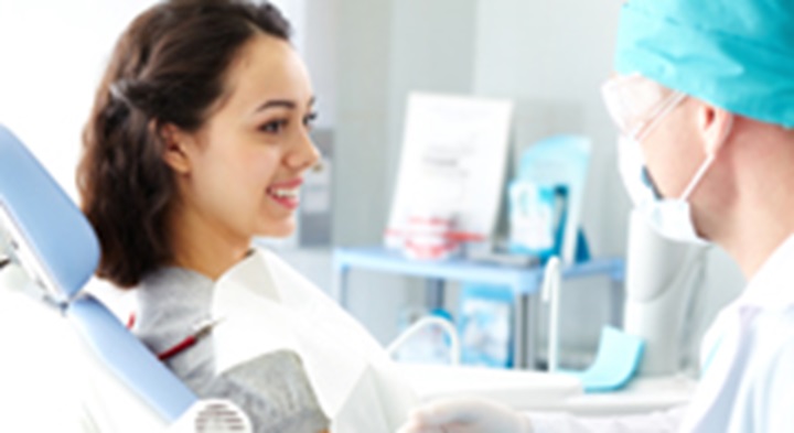 Woman at the dentist.