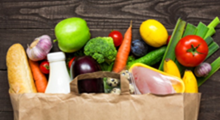 Healthy foods in a grocery bag.