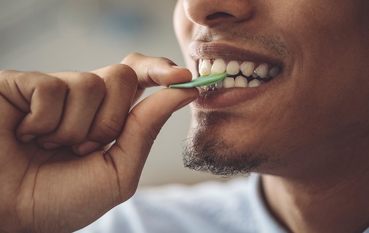 Man testing gum for authenticity