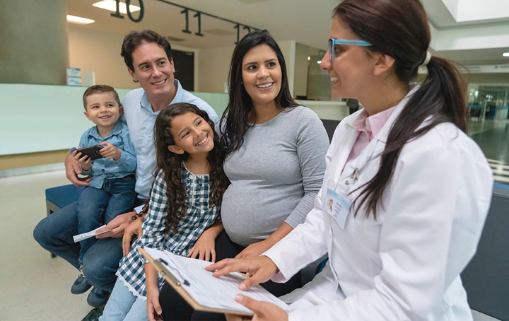Dentist talking to family