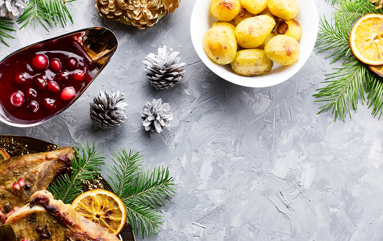 Thanksgiving table setting featuring cranberries and potatoes