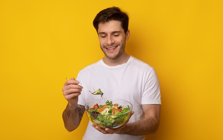 Person eating salad