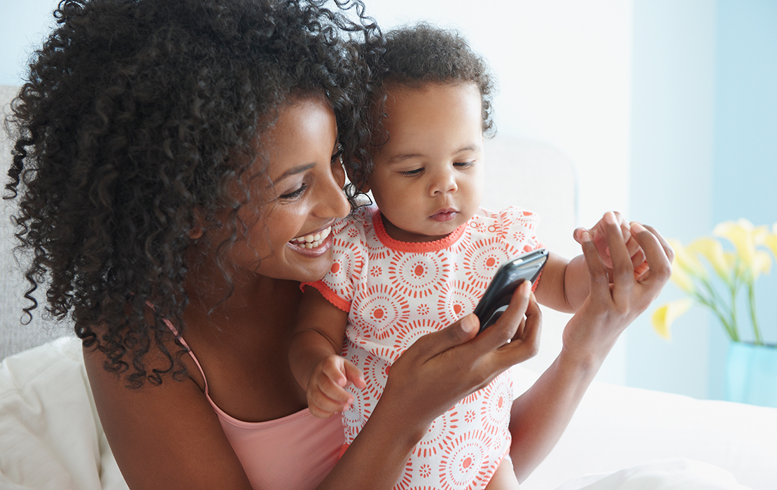 Mom and baby searching for info on device